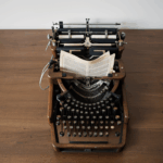 An antique typewriter showcasing intricate details and craftsmanship, perfectly suited for a vintage desk setting.
