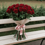 Chic rose arrangement on a rustic bench, adding elegance to any space.