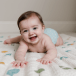 A baby enjoying playtime on a soft, comfortable blanket.