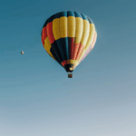 A breathtaking view of a colorful balloon in the sky, showcasing the beauty and grandeur of ballooning adventures.