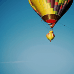 A stunning image of a hot air balloon journey, capturing the vibrant colors and majestic sky adventure.