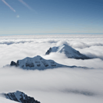 A beautiful mountain skyline with a snowy peak rising above the clouds, capturing the essence of alpine serenity.