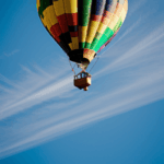 A striking image of a hot air balloon floating amidst the clouds, symbolizing dreams and adventure.