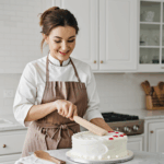 The cake decoration process in action with various tools and materials.