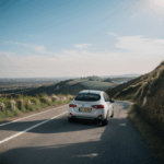 Car driving fun, captured with a vehicle descending a hill route.