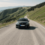 A car on a hill route, enjoying the adventurous drive down slopes.
