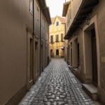 A picturesque cobblestone path in an old European town, lined with historic structures.