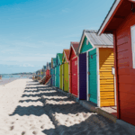Charming seaside huts painted in bright colors along the oceanfront