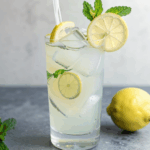 Refreshing iced lemonade with mint for a hot summer day.