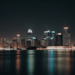 A breathtaking cityscape at night with iconic landmarks and bright lights.