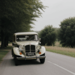 Classic car exuding charm on a country road, highlighting the elegance and historical allure of vintage vehicles in scenic landscapes.