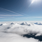 A breathtaking scene of a mountain partially covered by clouds, showcasing the serenity of high-altitude landscapes.