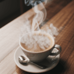 A steaming cup of coffee, nestled among rustic wooden charm.
