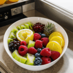 A colorful display of fresh fruit adding natural beauty to a kitchen setting.