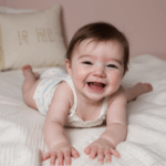 A curious baby crawling, enjoying the softness of a blanket.