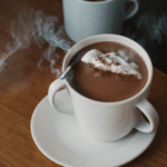Delicious hot chocolate with a swirl of whipped cream, inviting and warm.