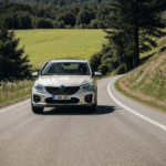 A downhill driving adventure with a car on a scenic hill path.