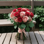 Timeless rose bouquet artfully arranged on a rustic wooden bench.