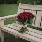 Vintage-style rose bouquet on a wooden bench, exuding timeless charm.