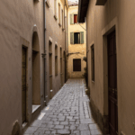 An alleyway in Europe, showcasing the beauty and charm of old towns.