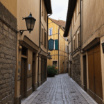 A cobblestone street in Europe, lined with historic buildings and charm.