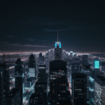 A breathtaking view of a futuristic city skyline illuminated at night with dazzling lights and modern skyscrapers reaching into the sky.