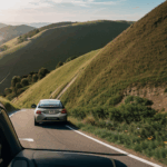 The experience of hill driving with a car on a thrilling descent.