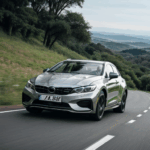 Hill driving fun captured with a car on a thrilling downhill path.