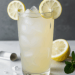 Lemonade topped with mint, served cold with ice.