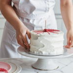 A beautifully decorated cake featuring intricate designs and vibrant colors.
