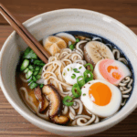 A traditional Japanese ramen dish, served steaming hot with a variety of colorful toppings.