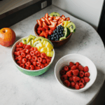 An assortment of fresh fruit beautifully arranged on a kitchen counter.