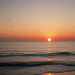 Majestic sea sunset with the horizon glowing in warm, vibrant colors.