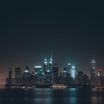 A metropolitan night skyline, where the urban environment is brought to life with luminous lights and futuristic architecture.