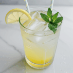 Summer refreshment: lemonade with mint and ice garnish.