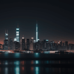 A modern urban landscape at night, showcasing a stunning array of city lights and tall buildings against a dark sky.