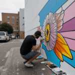 A detailed mural on a city wall, showcasing the skills of a street artist.