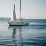 Nautical escape on a classic sailboat, where the calm sea provides a serene backdrop for exploration.
