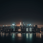 A captivating nighttime cityscape featuring a blend of contemporary architecture and sparkling city lights.