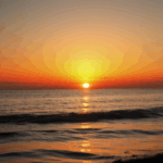 Ocean beauty at sunset with the horizon glowing in warm, vibrant colors.
