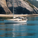 Exploring the ocean aboard a classic sailboat, a journey that reveals the peaceful allure of the sea.