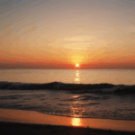 Ocean sunset magic with the sky ablaze in warm, vibrant hues.