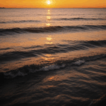 Ocean sunset views with the sky painted in warm, vibrant colors.