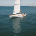 A peaceful ocean voyage featuring a classic sailboat, showcasing the elegance of sailing in style.