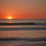 Peaceful sunset moments with vibrant colors reflecting over the calm sea.
