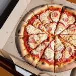 Gourmet pizza with a variety of toppings fresh out of the oven