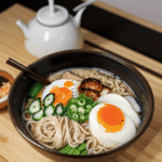 The perfect ramen bowl, steaming with an inviting aroma and topped with fresh ingredients.