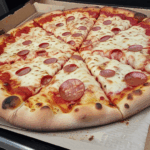 Pizza with a perfect blend of cheese and toppings, fresh from the oven