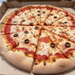 A beautifully baked pizza with a golden crust and a variety of toppings