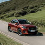 Road trip thrill depicted by a car descending a beautiful hill.